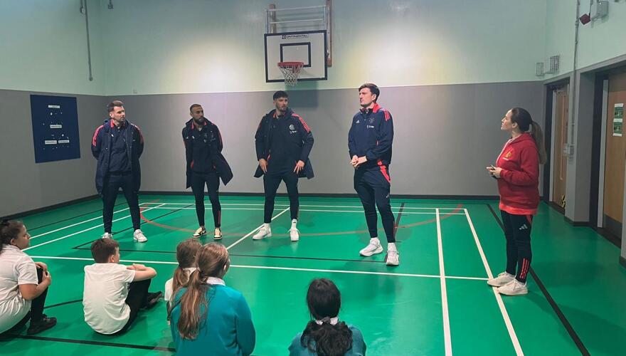 MUFC Players Visit Pioneer House